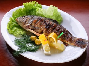 Dish with fish by a carp